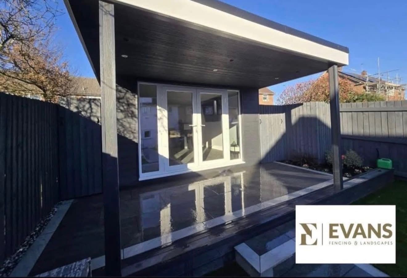 Garden room with black cladding and glazed bi-fold doors