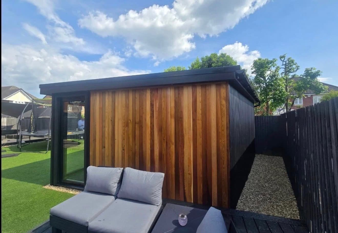 Cedar-clad garden room with an outdoor seating area