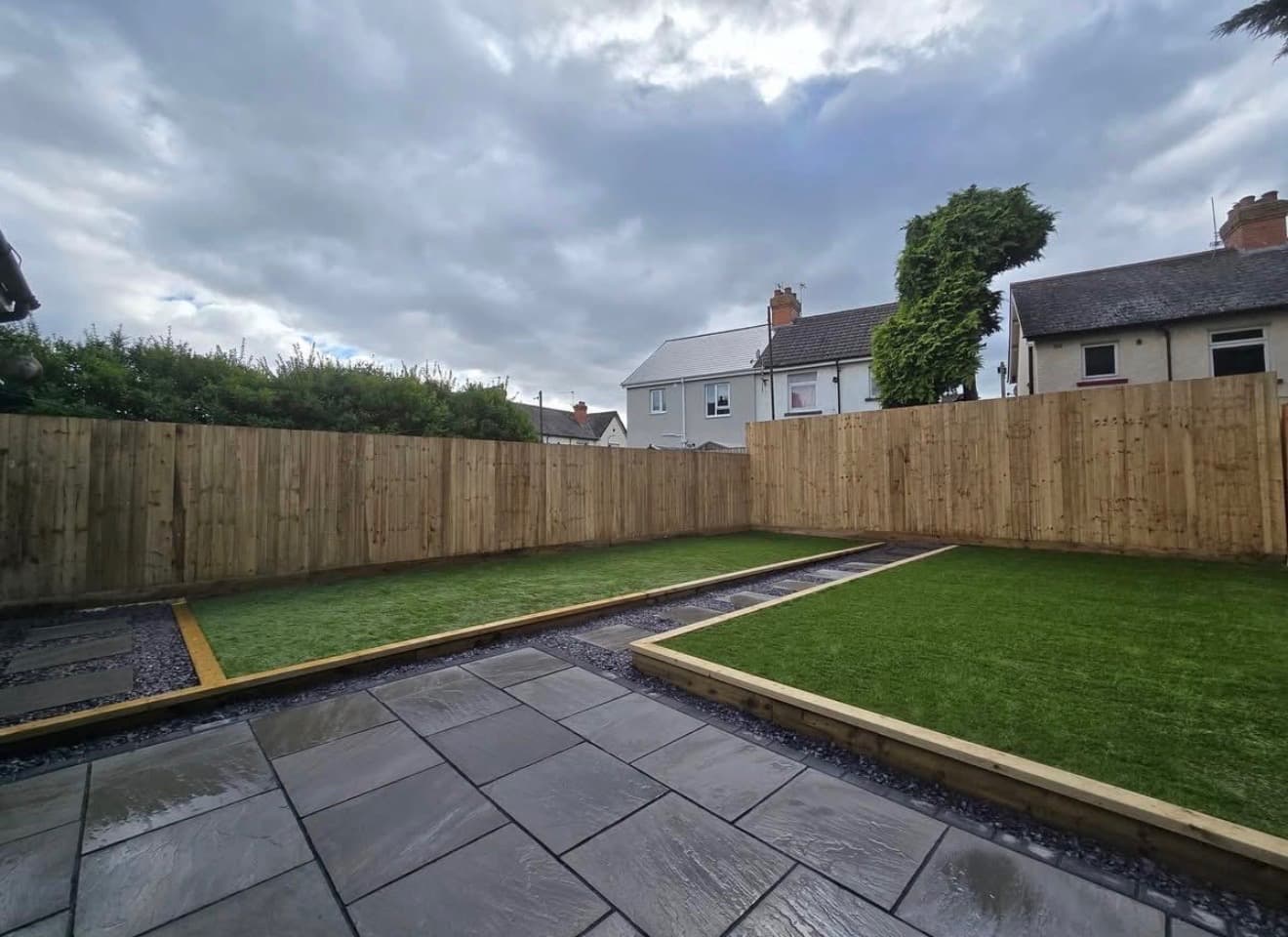 Fully transformed garden with new fencing, lawns and paved paths