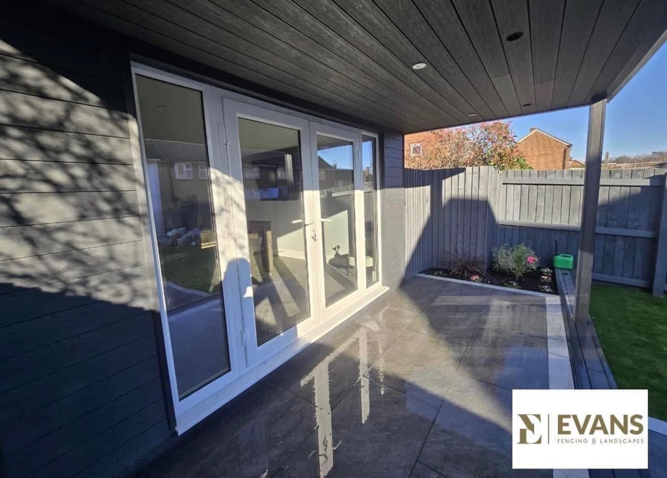 Paved patio installed outside a garden room in South Wales