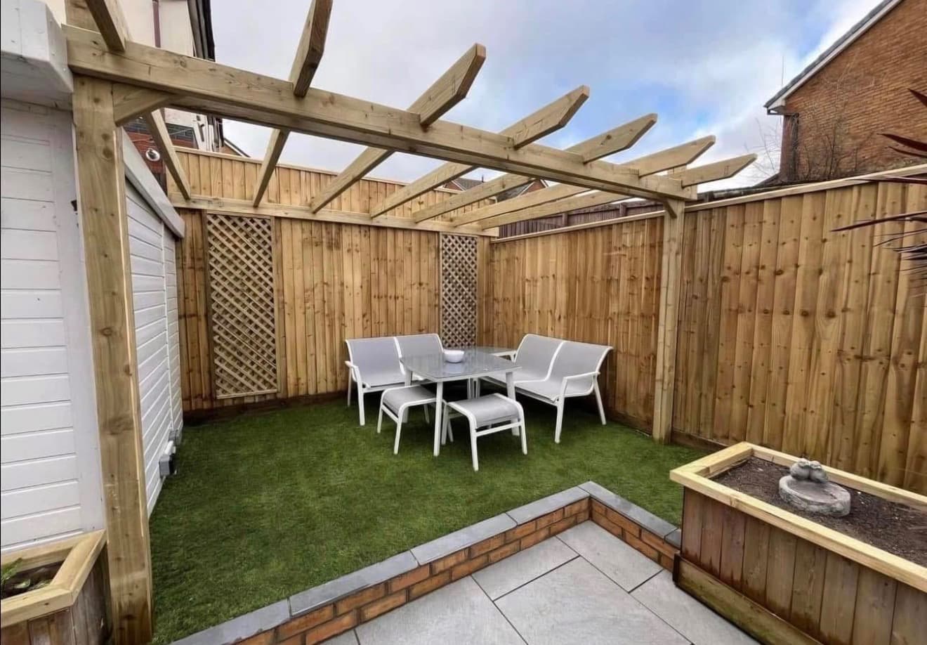 Artificial lawn beside a patio and timber pergola