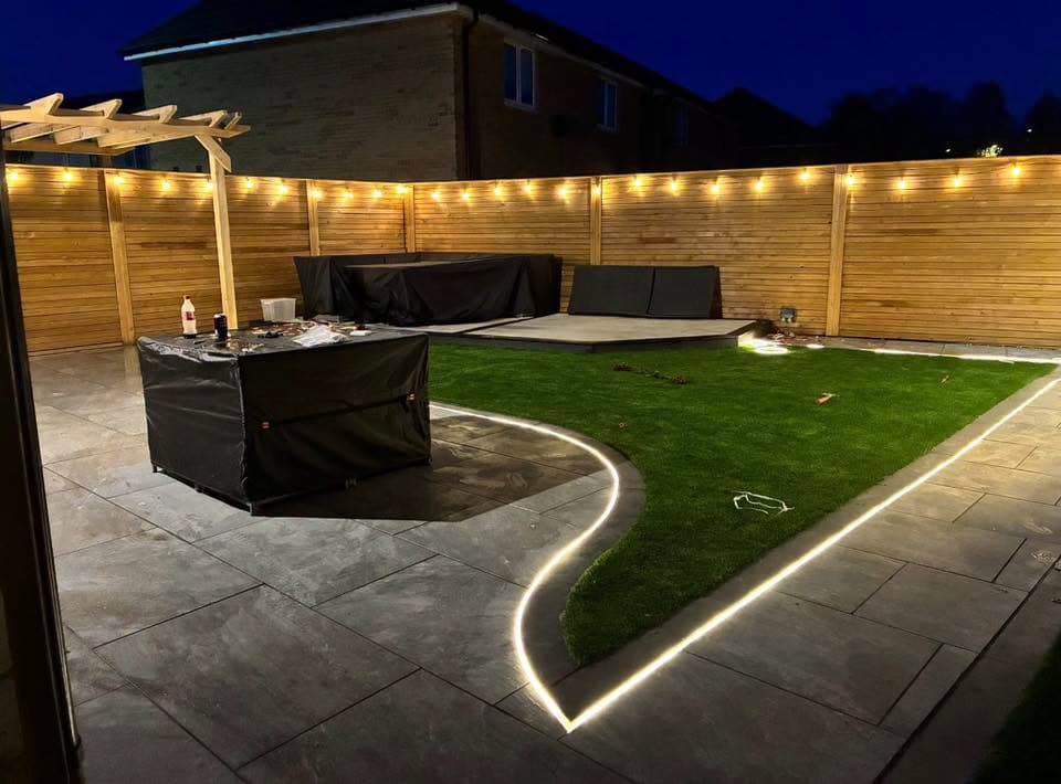 Porcelain patio with new fencing, artificial turf and feature lighting